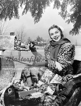 846-02797876em-1950s-WOMAN-IN-SLEIGH-IN-LEOPARD-COAT-AT-MAILBOX-WITH-PACKAGES---.jpg