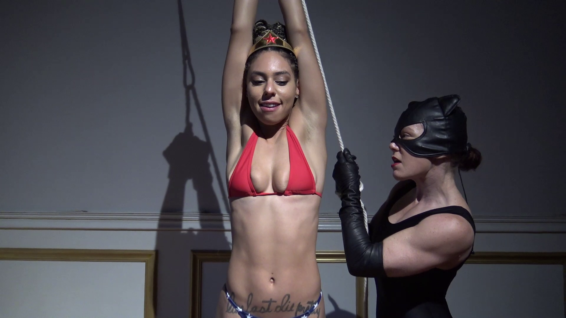 Wonder Woman in the clutches of Catwoman.png