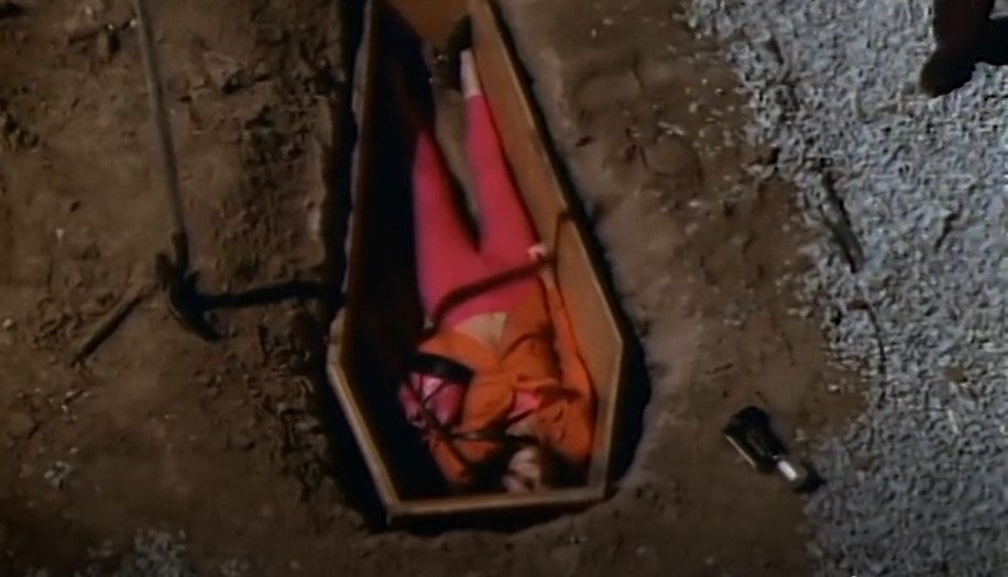 Zander in the coffin about to be buried alive.jpg